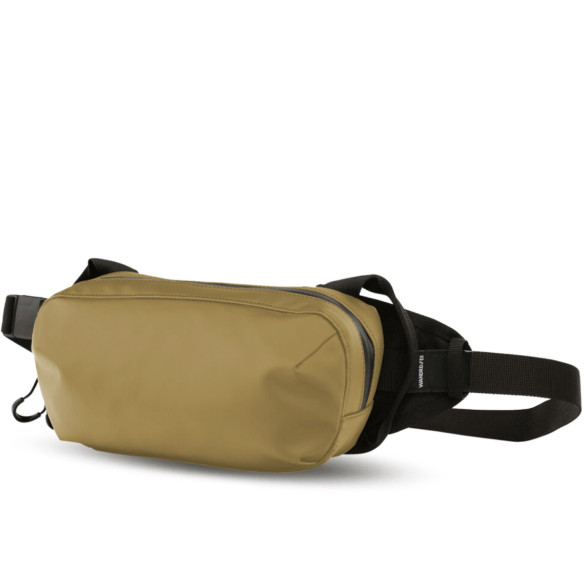 Поясная сумка WANDRD D1 Fanny Pack Жёлтая  Объём :	2 л • Материал :	нейлон, брезент • Особенности конструкции :	водоотталкивающее покрытие